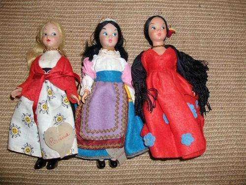 Three lovely traditionally dressed collectors dolls